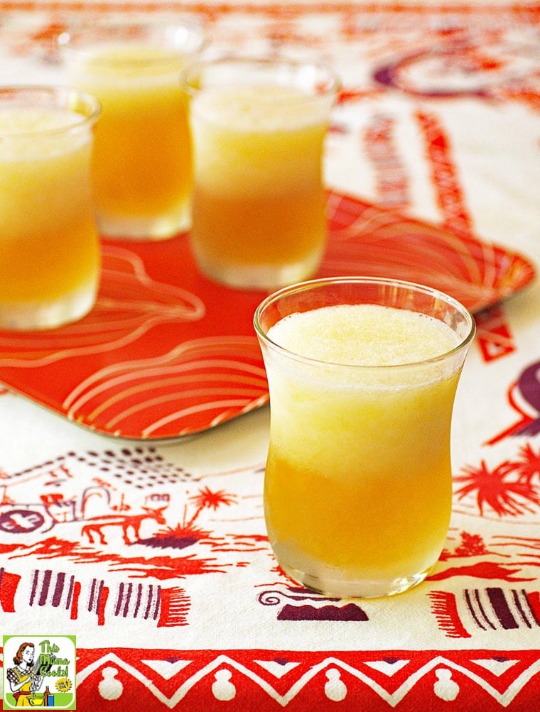 A tray of Peach & Cherry Beer Margarita frozen cocktails served on a Mexican tablecloth.