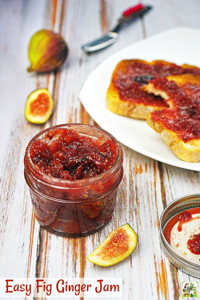 A jar of fig jam with fig jam toast on a white plate in the background.