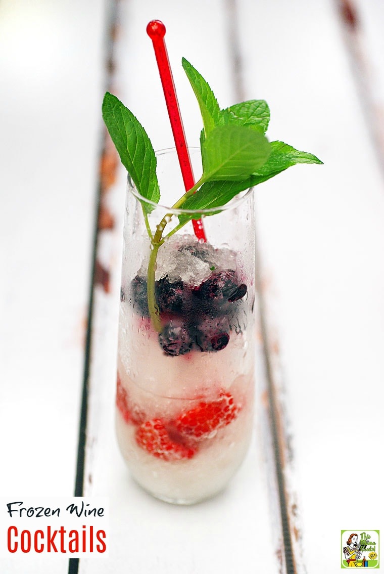 A glass of frozen wine and berry garnish.