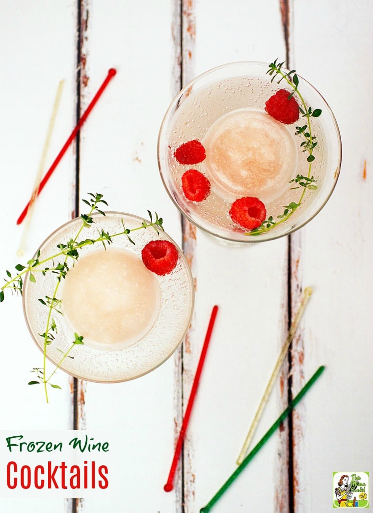 Overhead shot of frozen wine cocktails with herb and berry garnish and swizzle sticks.