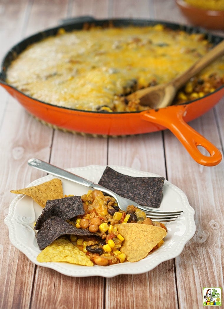 A plate and skillet of Easy Nachos and tortilla chips. 