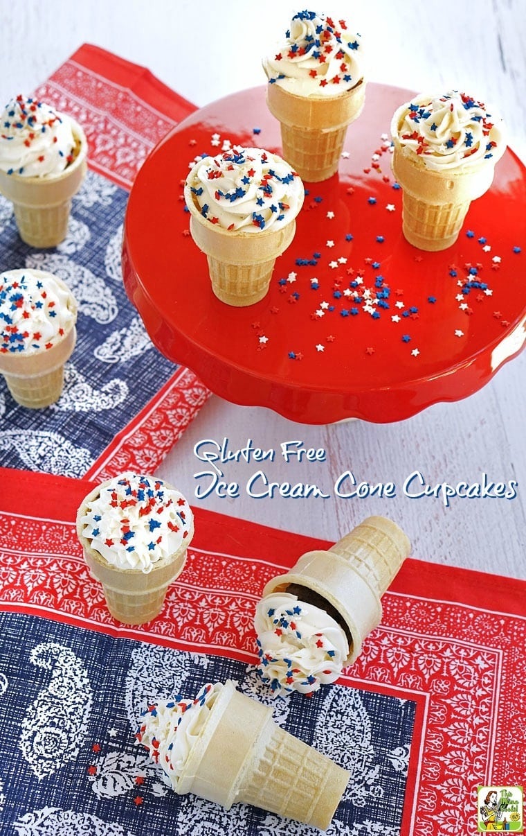 Ice Cream Cones Cupcakes with red white and blue star shaped sprinkles on a red cake stand and red white and blue napkins.