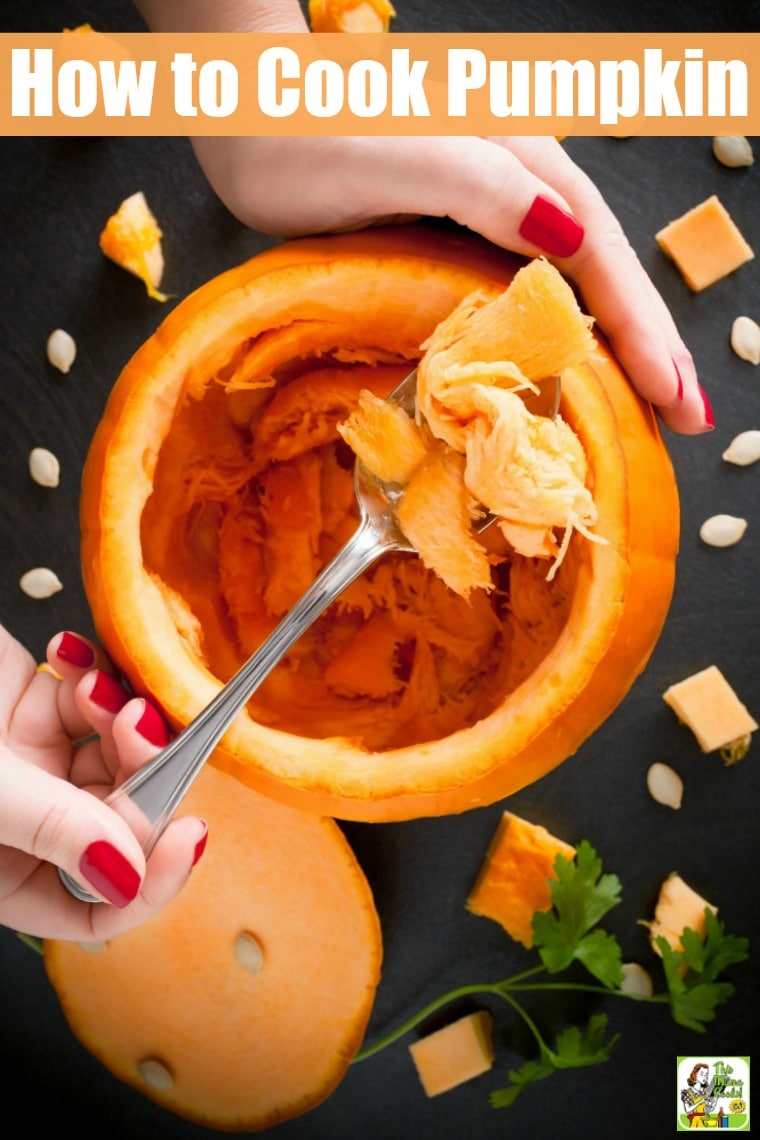 Scooping out pumpkin seeds from a raw pumpkin.