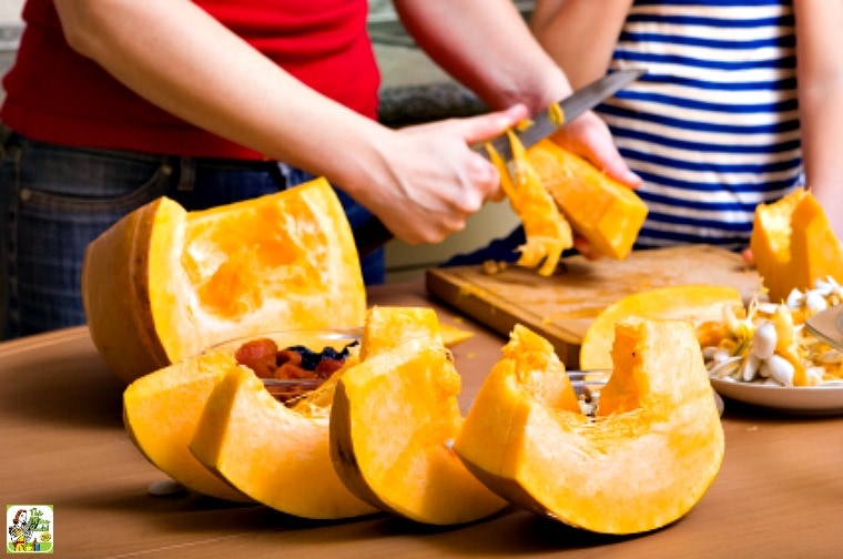 Chopping up a large pumpkin.