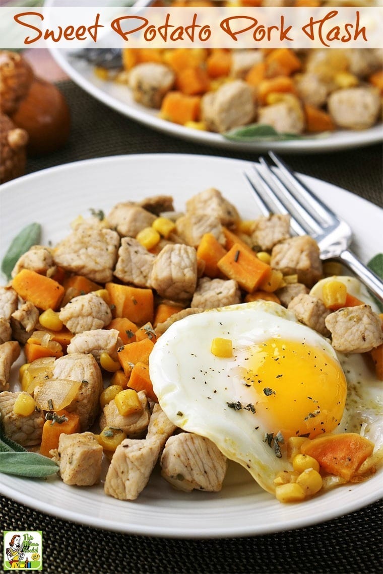 A plate of Sweet Potato Pork Hash with sunny side up eggs, and a fork 