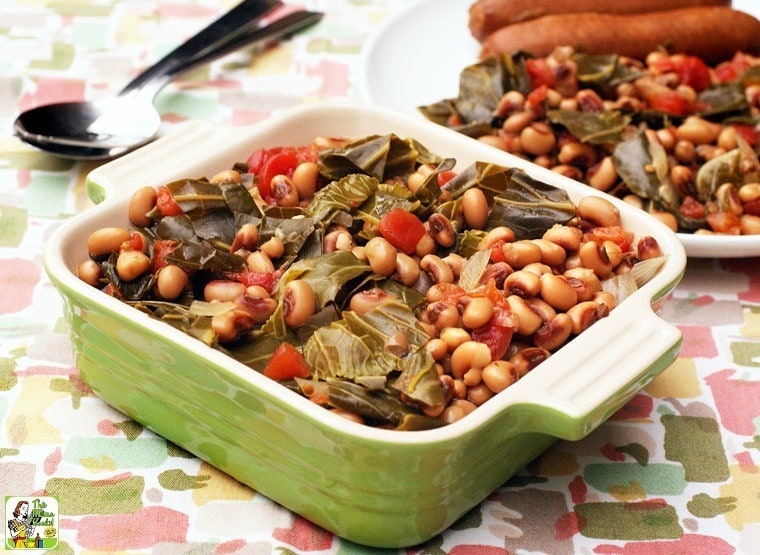 Slow Cooker Hoppin' John served in a square green dish with spoons and a plate of hoppin john in the background.