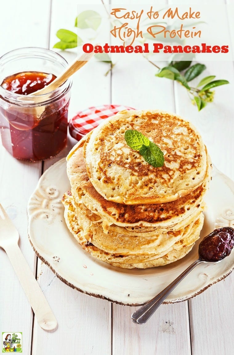 A stack of High Protein Oatmeal Pancakes on a plate with a jar of jam.