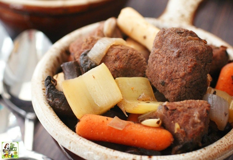 Bowl of venison stew with onions, parsnips, mushrooms, and carrots.