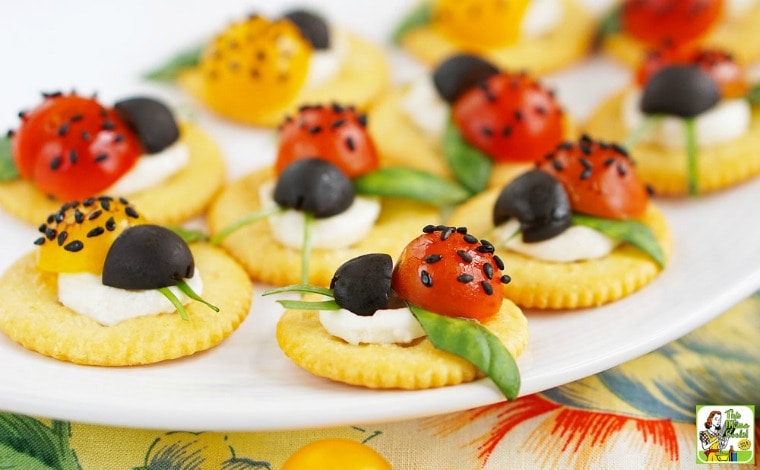 Caprese Ladybugs Appetizers on a white plate.