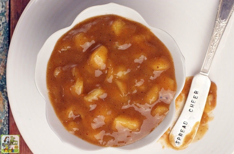 A bowl of healthy apple pie filling with spread cheer serving knife.