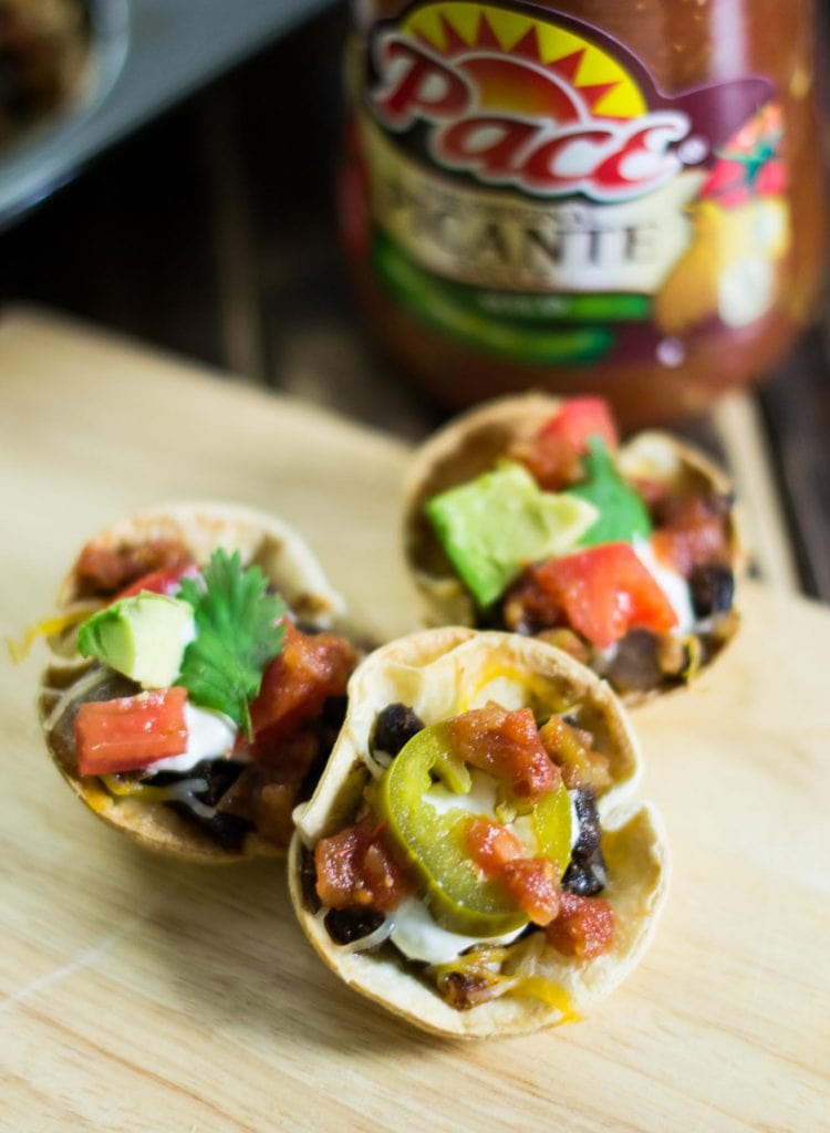 Three Easy Vegetarian Taco Cups on a wooden board.