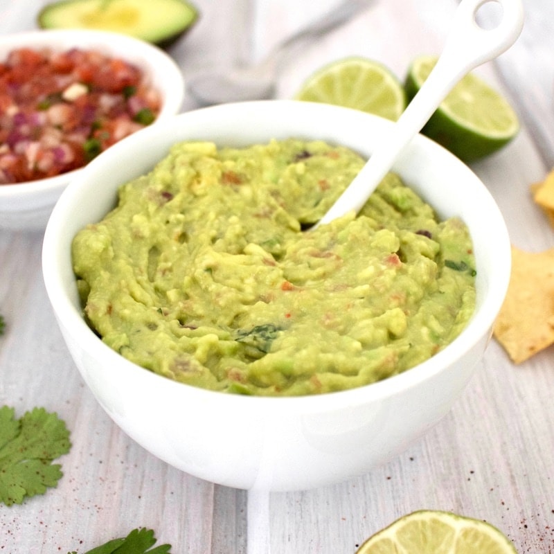 Bowl of Five Minute Guacamole with spoon.