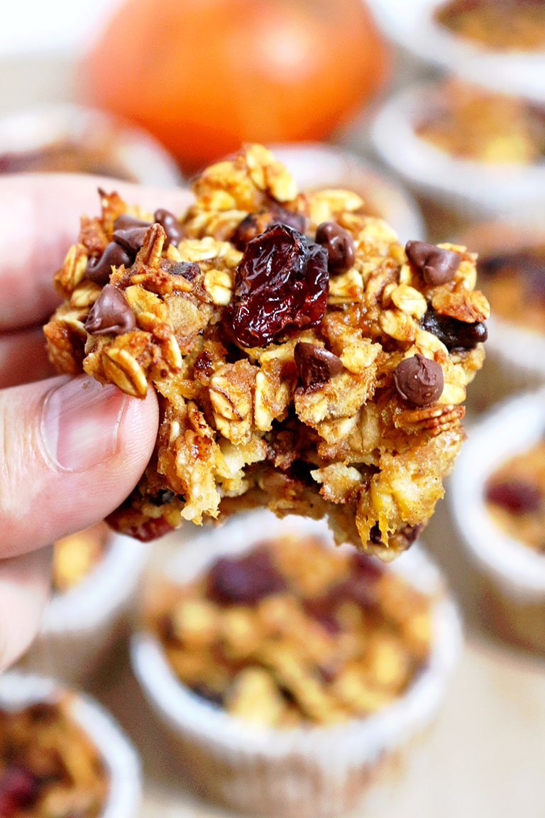 Easy Pumpkin Oatmeal Cups with a bite taken out of it.