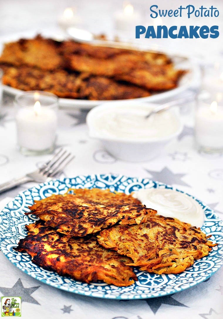 A plate of Sweet Potato Pancakes with sour cream or Greek yogurt.