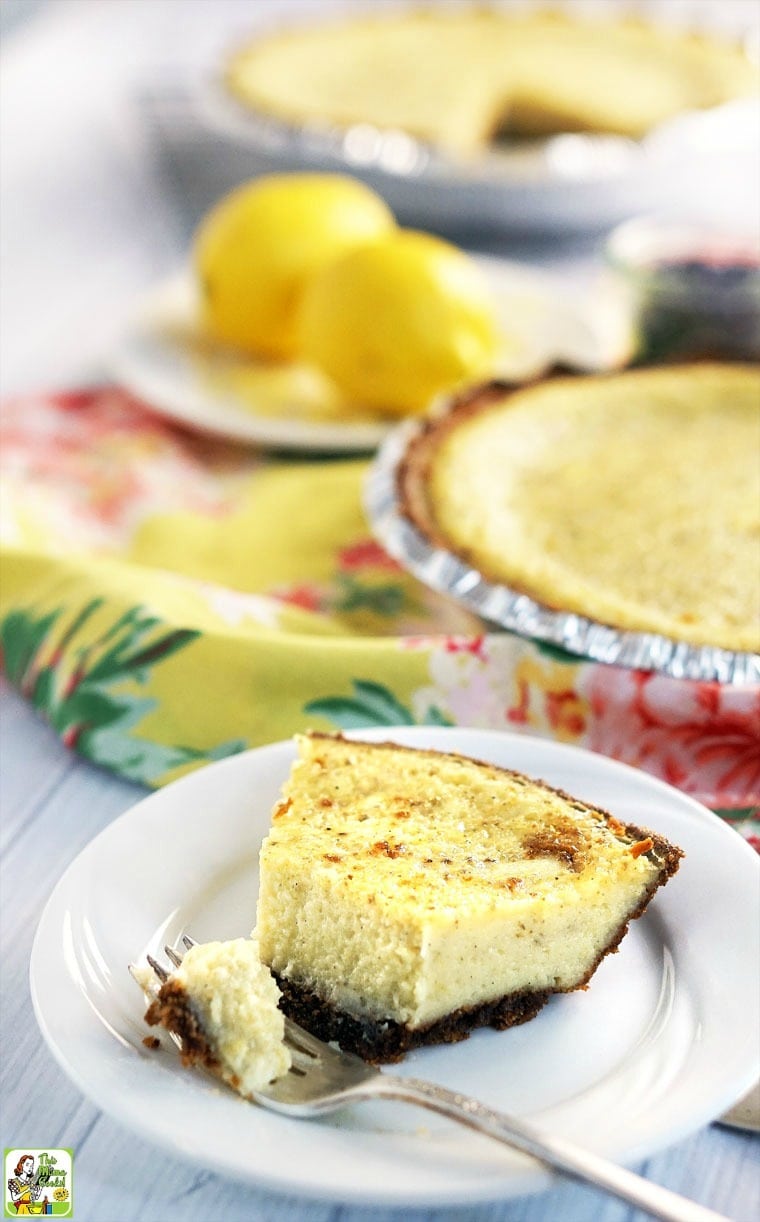 A slice of buttermilk pie on a white plate with a fork.