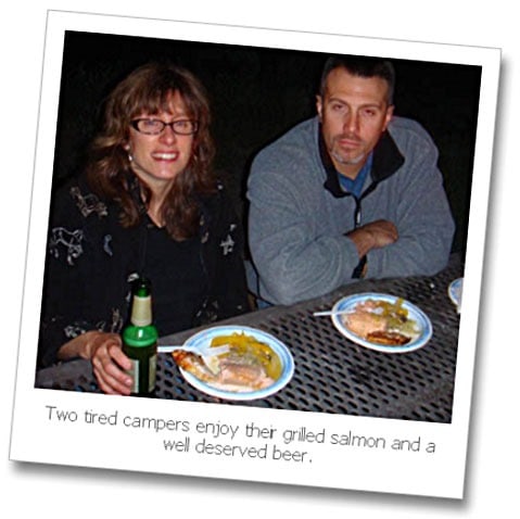 Picture of the author and her husband enjoying cooked salmon in foil on the grill.