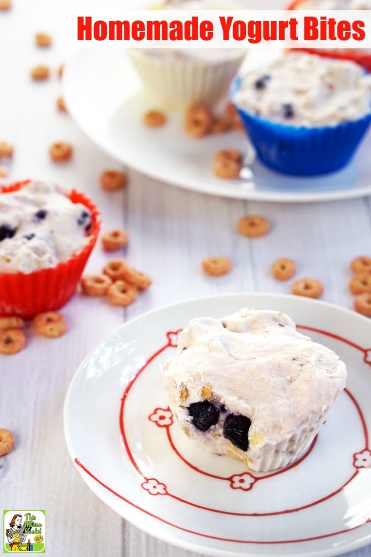 Homemade Yogurt Bites in silicon baking cups on a plate with cheerios.