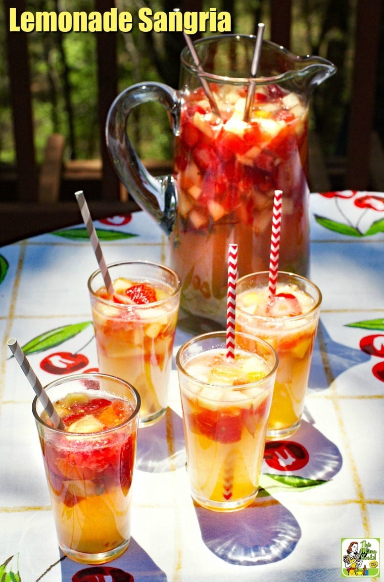 A pitcher and glasses of Lemonade Sangria with striped straws.