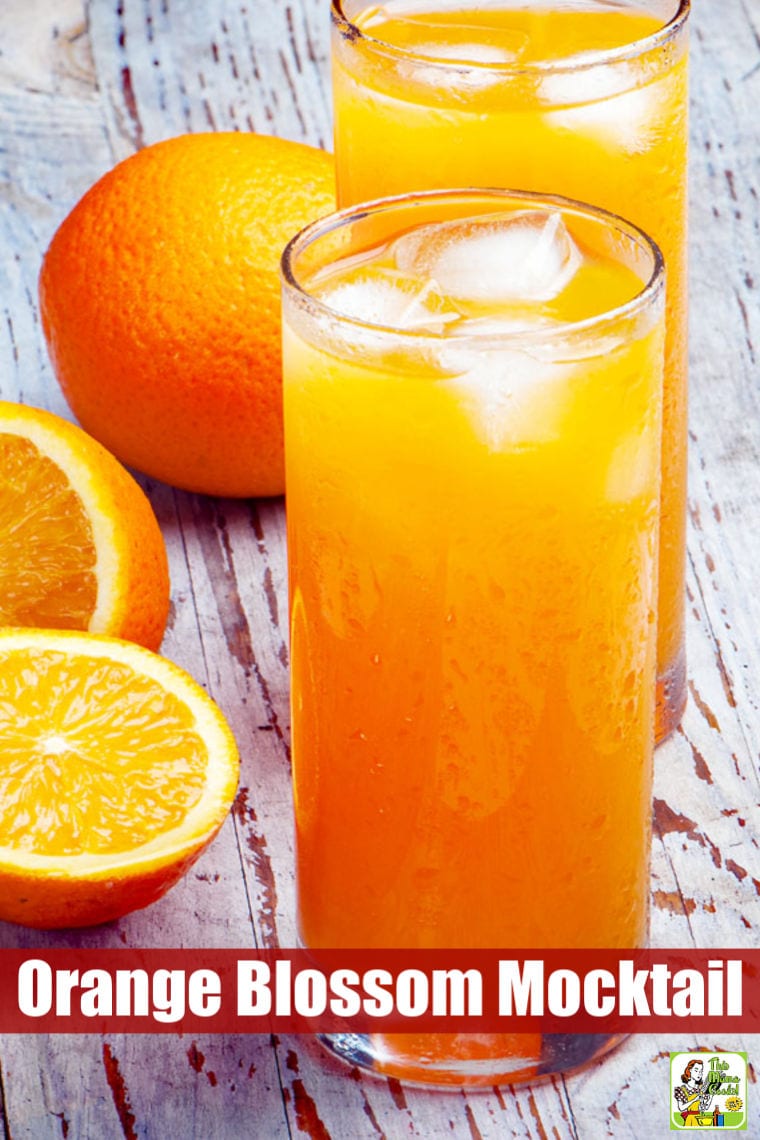 Two glasses of an orange mocktail drink with ice cubes 