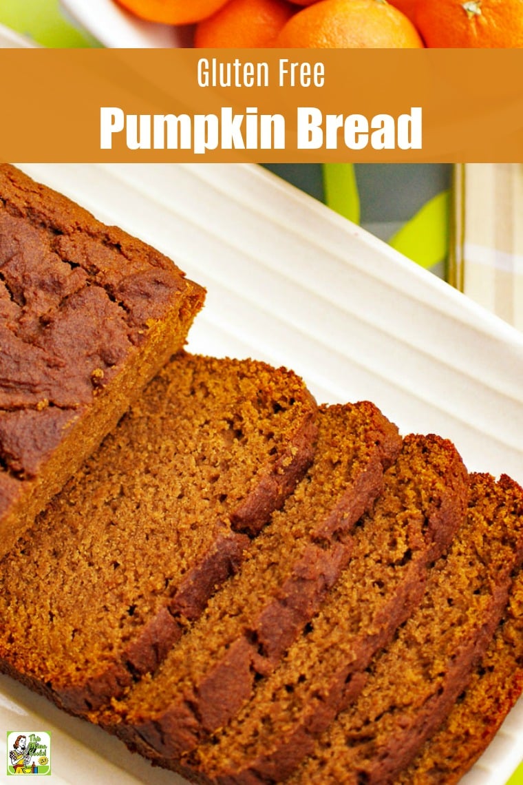 Closeup of a  loaf of  Pumpkin Bread sliced up on a white plate.