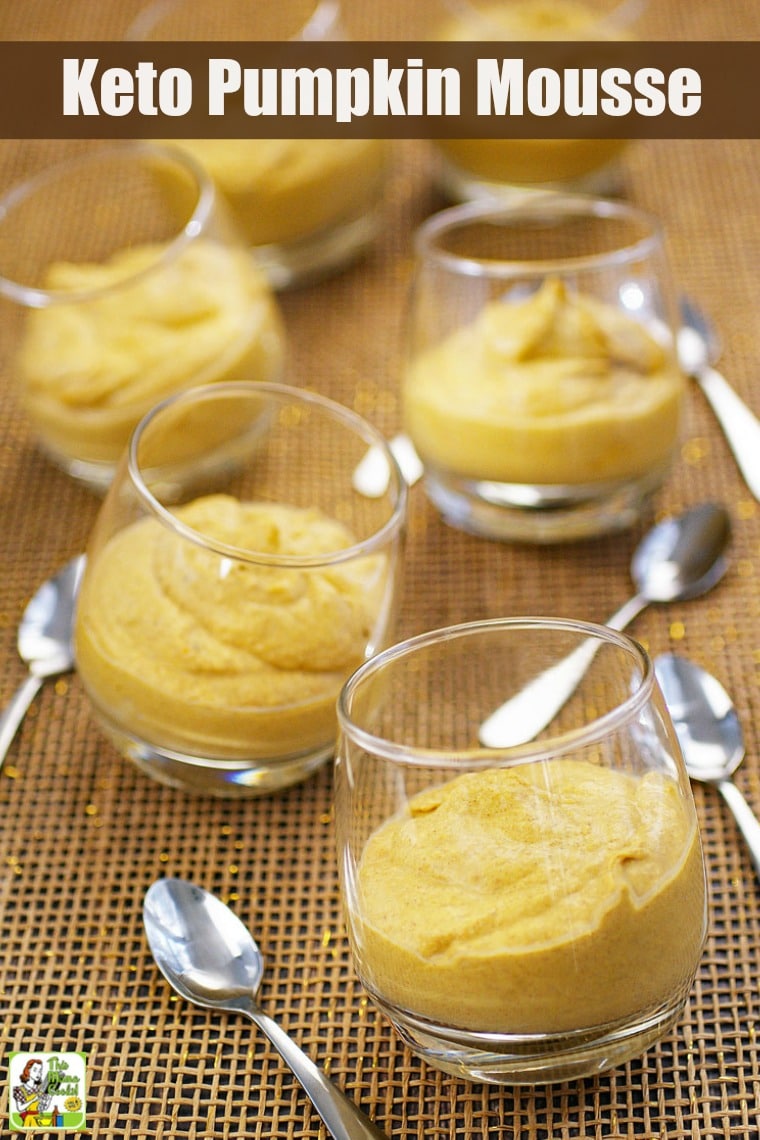 Glasses of pumpkin mousse with small spoons.