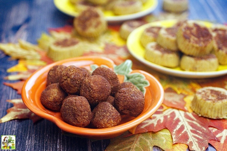 Dishes and plates of Pumpkin Fudge on an autumn leaf placemat.