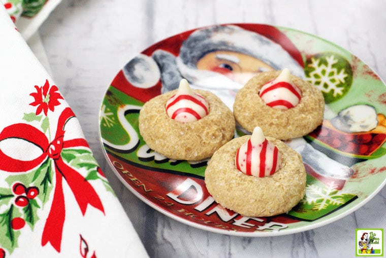 A Christmas plate of Peppermint Thumbprint Hershey Kiss Cookies