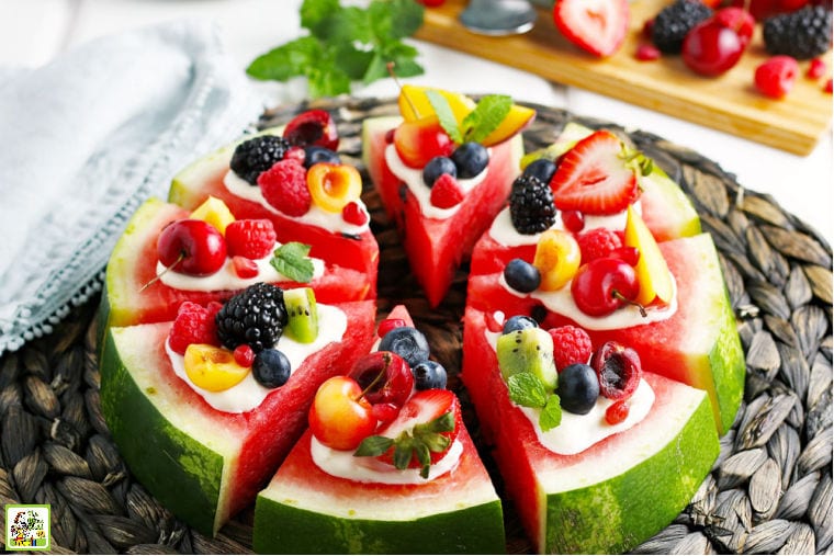 Watermelon Pizza on a woven mat with a light blue napkin.