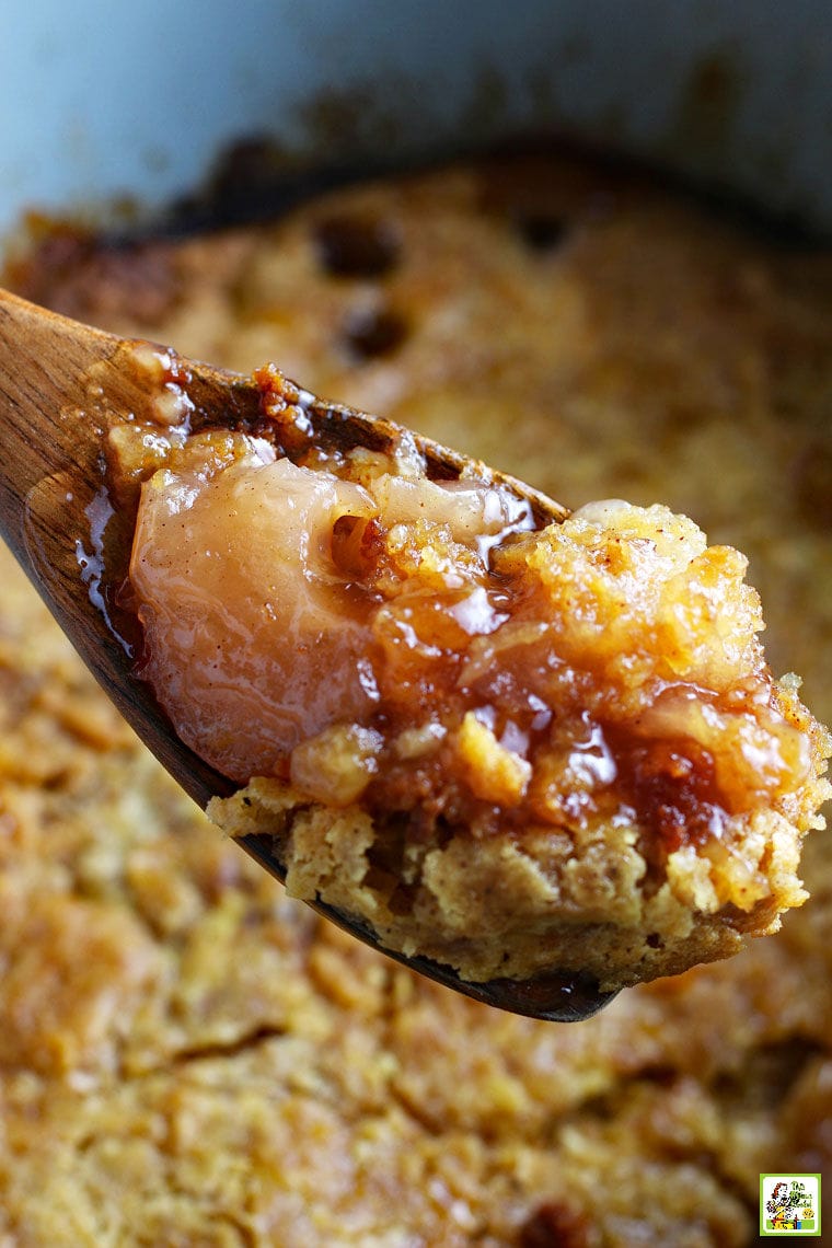 A wooden spoonful of apple cobbler.