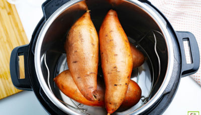 Sweet potatoes sitting on a trivet in a Instant Pot pressure cooker.