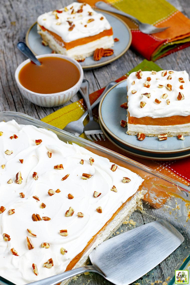 Plates and a baking dish of Pumpkin Cheesecake Lasagna.