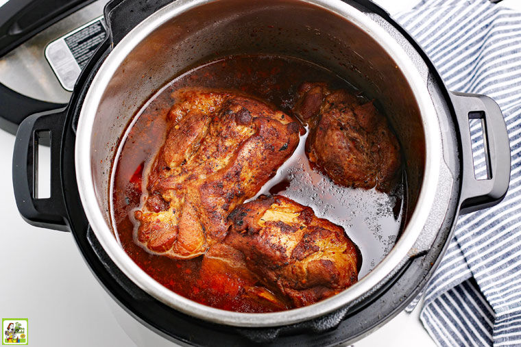 Cooked pieces of pork in the pressure cooker.