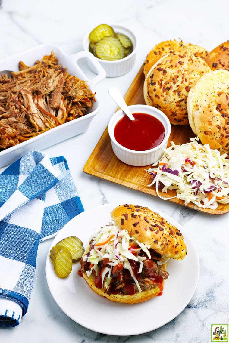 Pressure cooker shredded pork, BBQ sauce and pork sandwich fixings, and a BBQ pork sandwich with coleslaw and pickles.