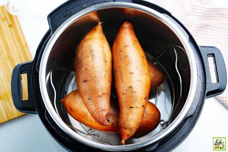 Cooking a stack of sweet potatoes in a pressure cooker Instant Pot.