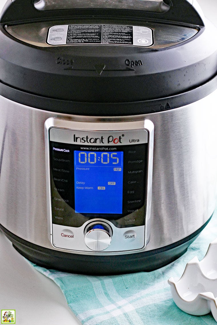 A 6-quart Instant Pot Pressure Coooker on a light blue dish towel.