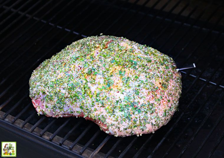 Smoking an herb encrusted boneless leg of lamb roast on a pellet smoker grill.